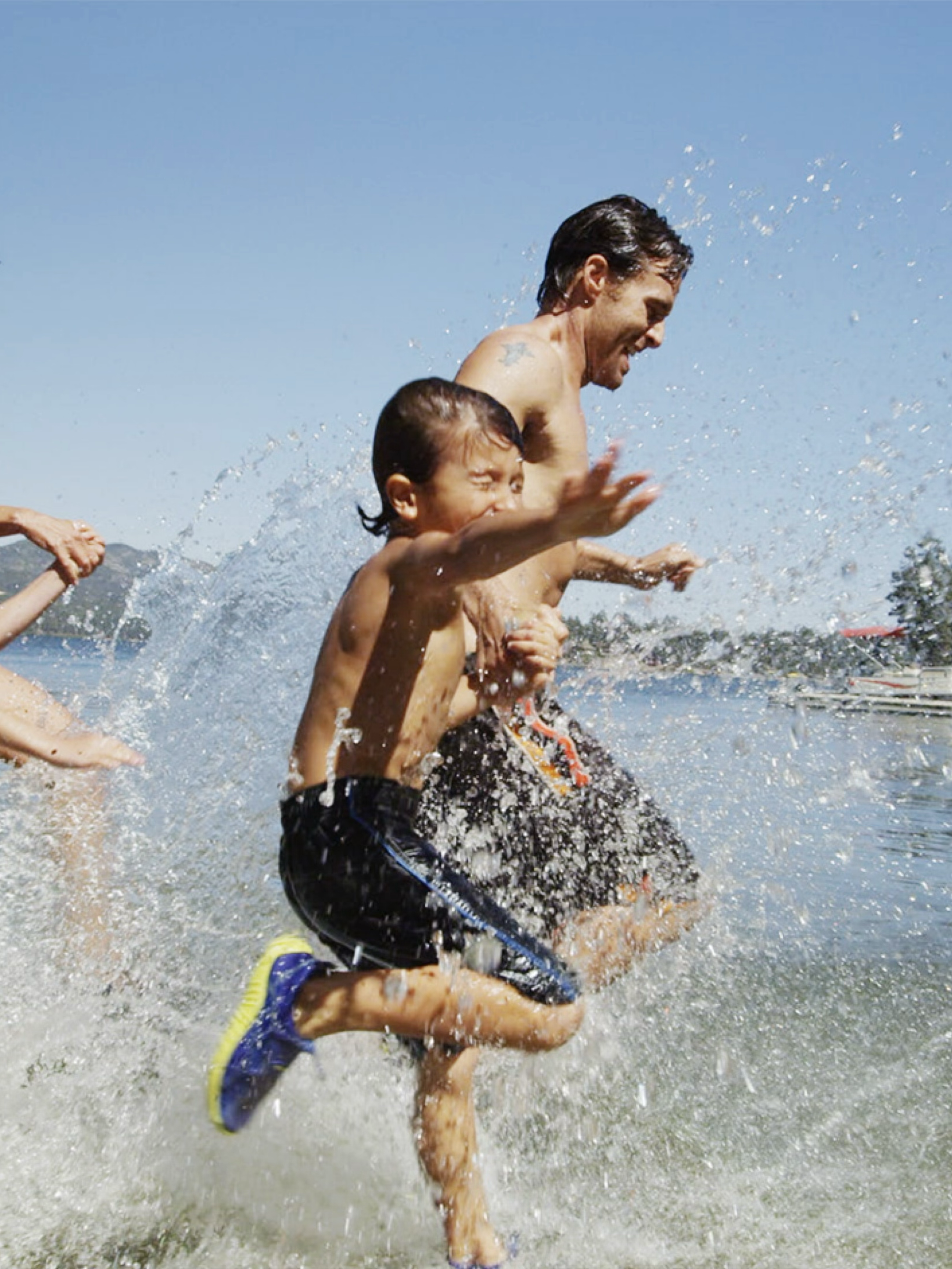A family playing and splashing in the surf