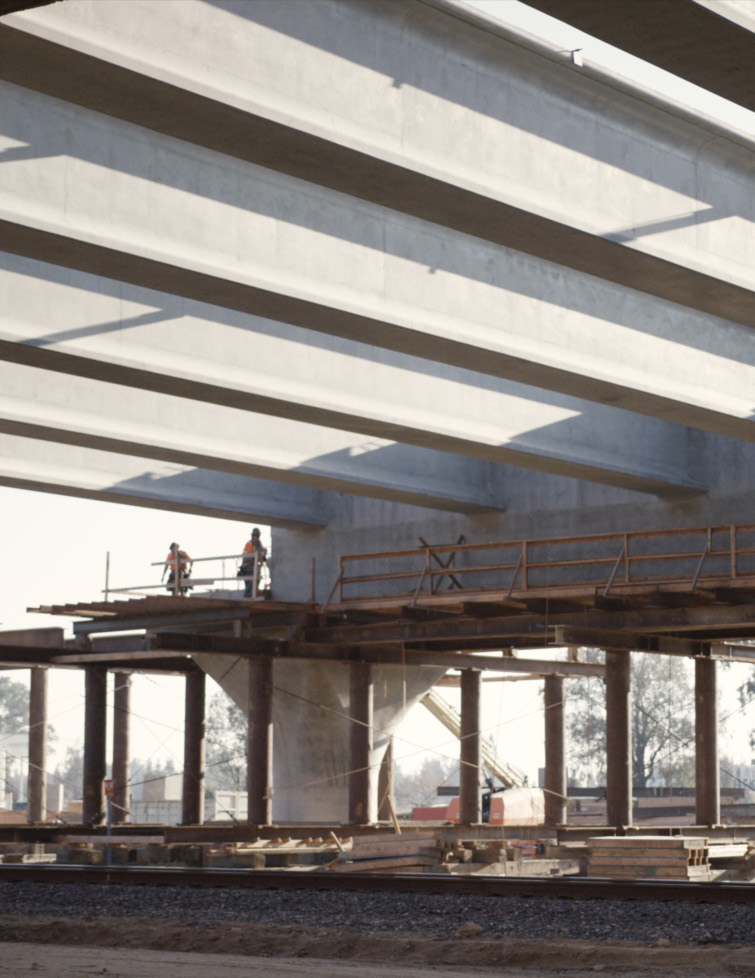 Exposed structural steel and concrete beams on an active Los Angeles construction site