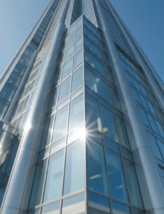 Glass skyscraper facade, low-angle view