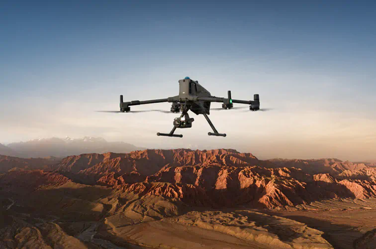 Drone hovering over a desert landscape during an aerial photography flight