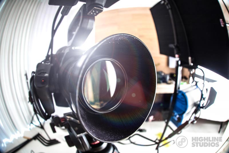 Highline Studios crew filming a corporate video interview on set, directed by Damon Hoydysh
